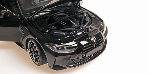Minichamps 2024 BMW M4 Coupe (G82) w/ Black Carbon Roof Black Metallic 1:18
