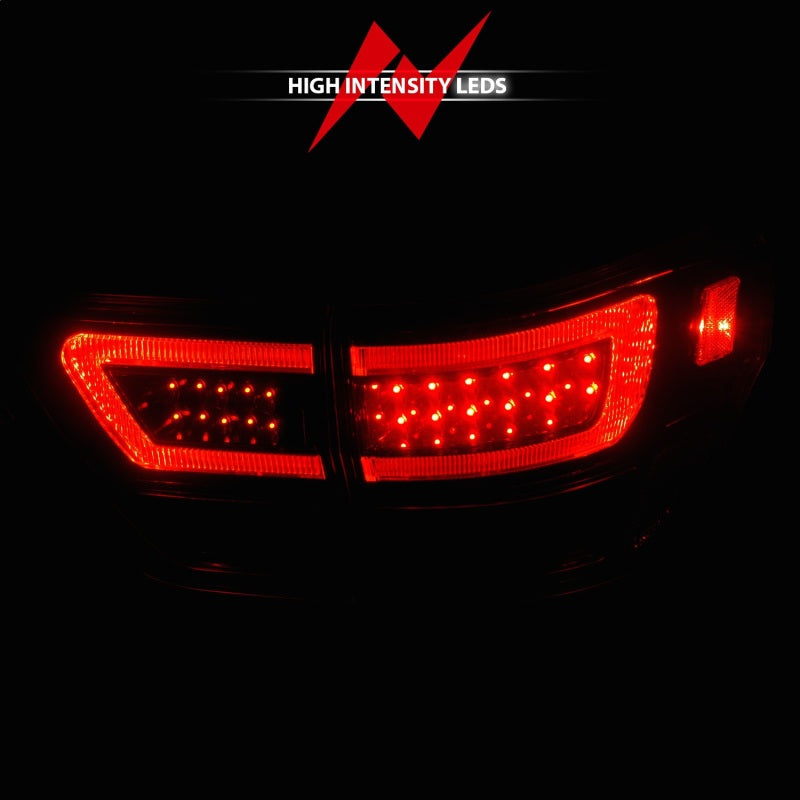 ANZO 11-13 Jeep Grand Cherokee LED Taillights w/ Lightbar Black Housing/Clear Lens 4pcs 311439